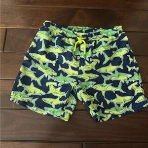 Sunuva boy’s Lime Green and Navy Shark Swim Shorts.